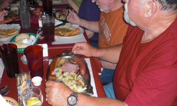 Ernest Comeau letting out the belt